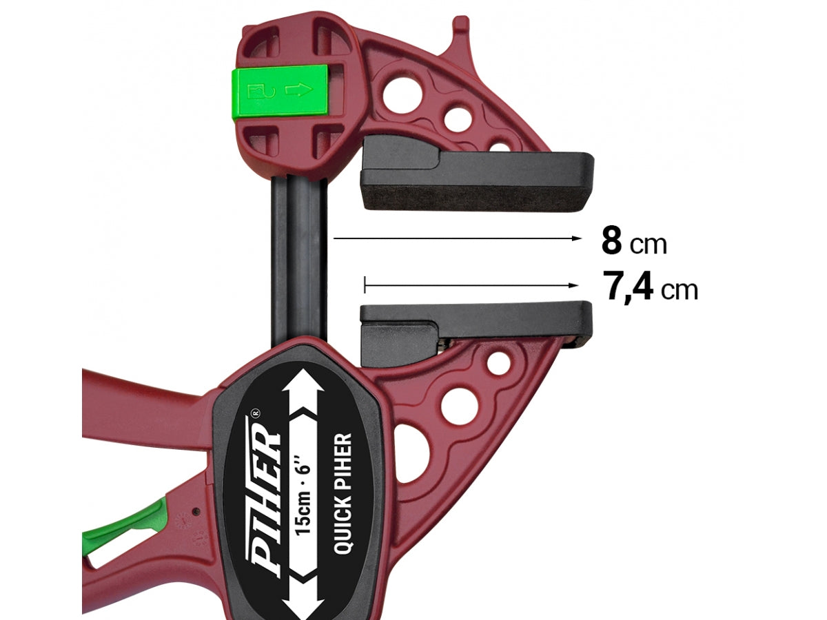 A close-up of the large 7.4cm non-slip pads on the Quick Piher, protecting a wood surface.