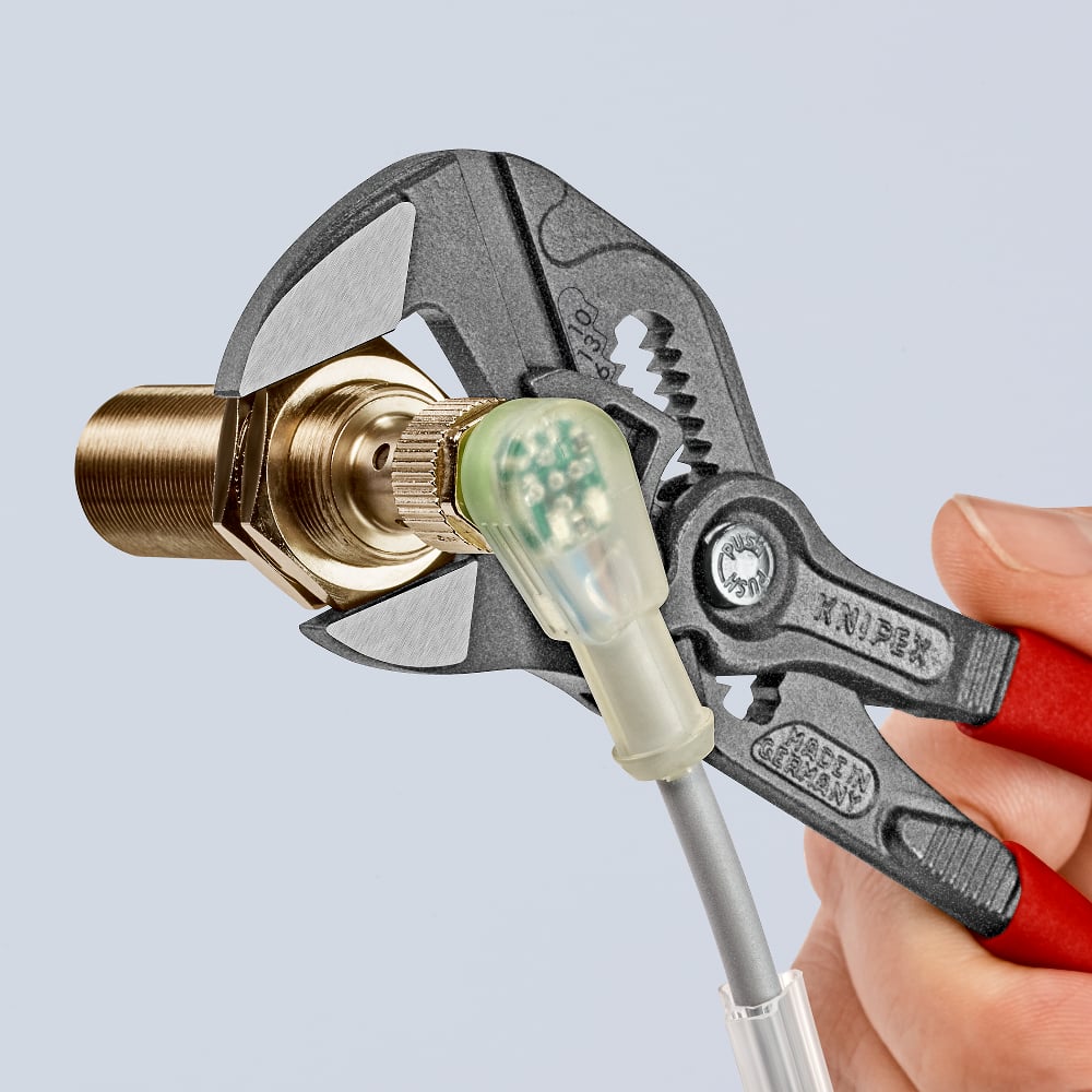 Adjustable KNIPEX Pliers Wrench grips widths up to 40 mm for plumbing and maintenance tasks.