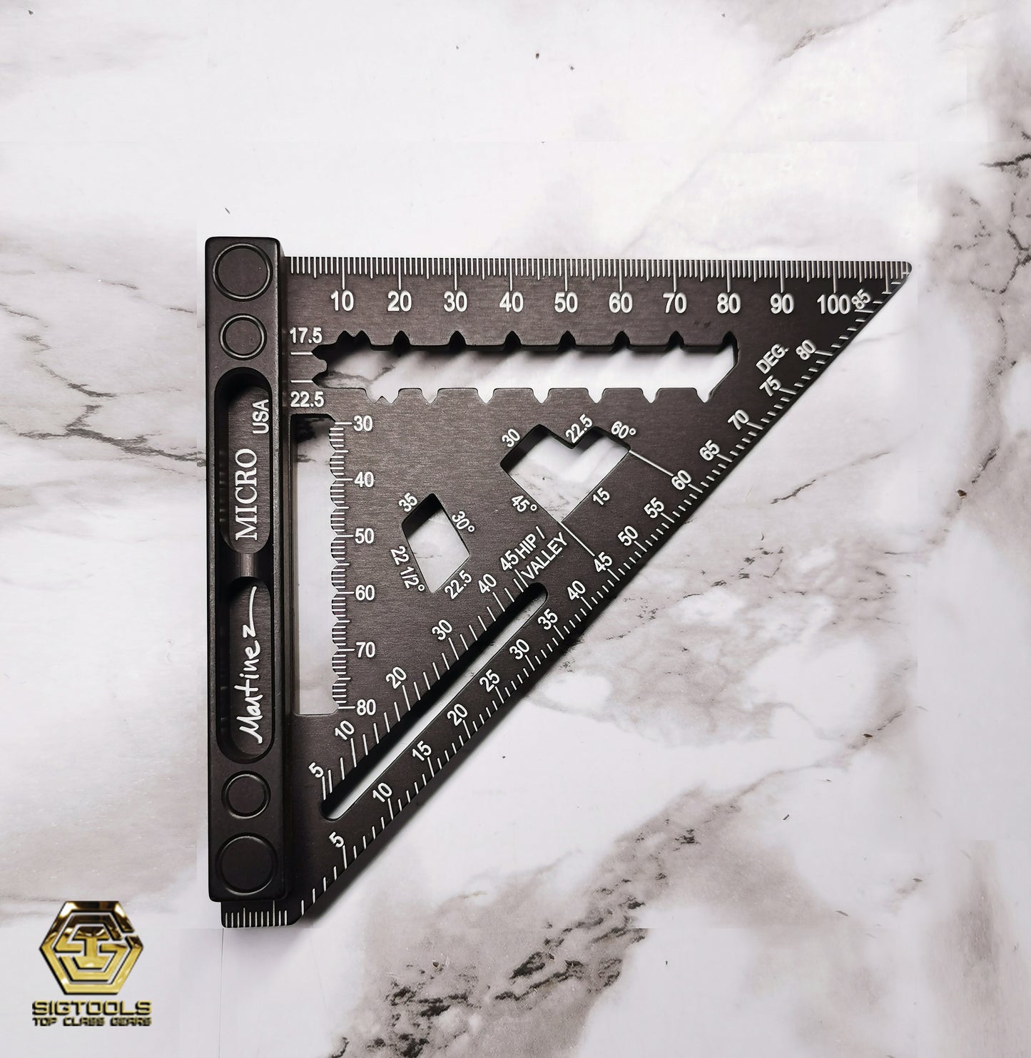 Photograph of the black Martinez Micro Square on white marble background – Metric Version, showcasing its compact design and precision engineering for metric measurements.