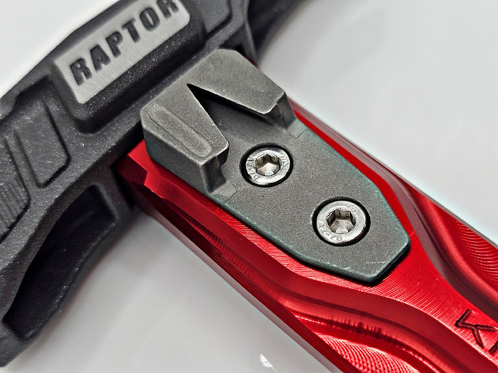 Close-up detail of the durable, hardened 17-4PH stainless steel tip on the Kinetic Customs Raptor Replaceable Side Nail Puller.
