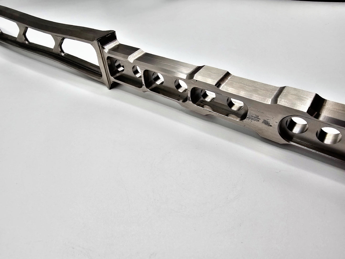 Close-up of the Titan titanium hammer handle featuring air pockets for shock absorption