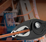 The unique three-point system of the TwinGrip, demonstrating a reliable grip on a flat workpiece.